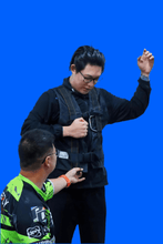Load image into Gallery viewer, Instructor demonstrating emergency procedure with trainee in GLH Systems training jacket