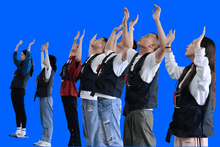 Load image into Gallery viewer, Group of trainees practising emergency procedures wearing GLH Systems training jackets
