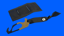 Load image into Gallery viewer, Black archery bow release aid with gold clip on a blue background
